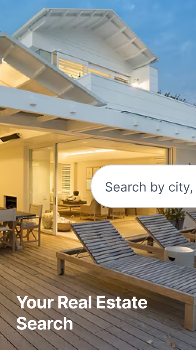 Stonehaus Realty home search: a lit-up house at dusk with the search box and the line Your Real Estate Search
