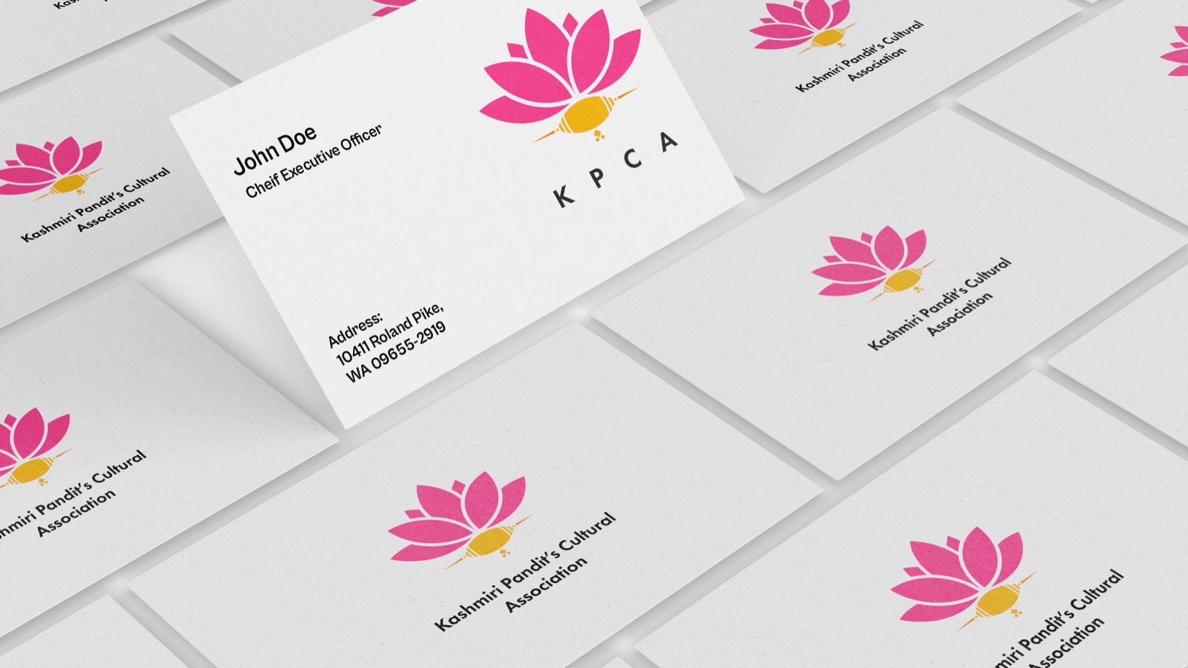 Rows of KPCA business cards with the lotus mark and the association’s name