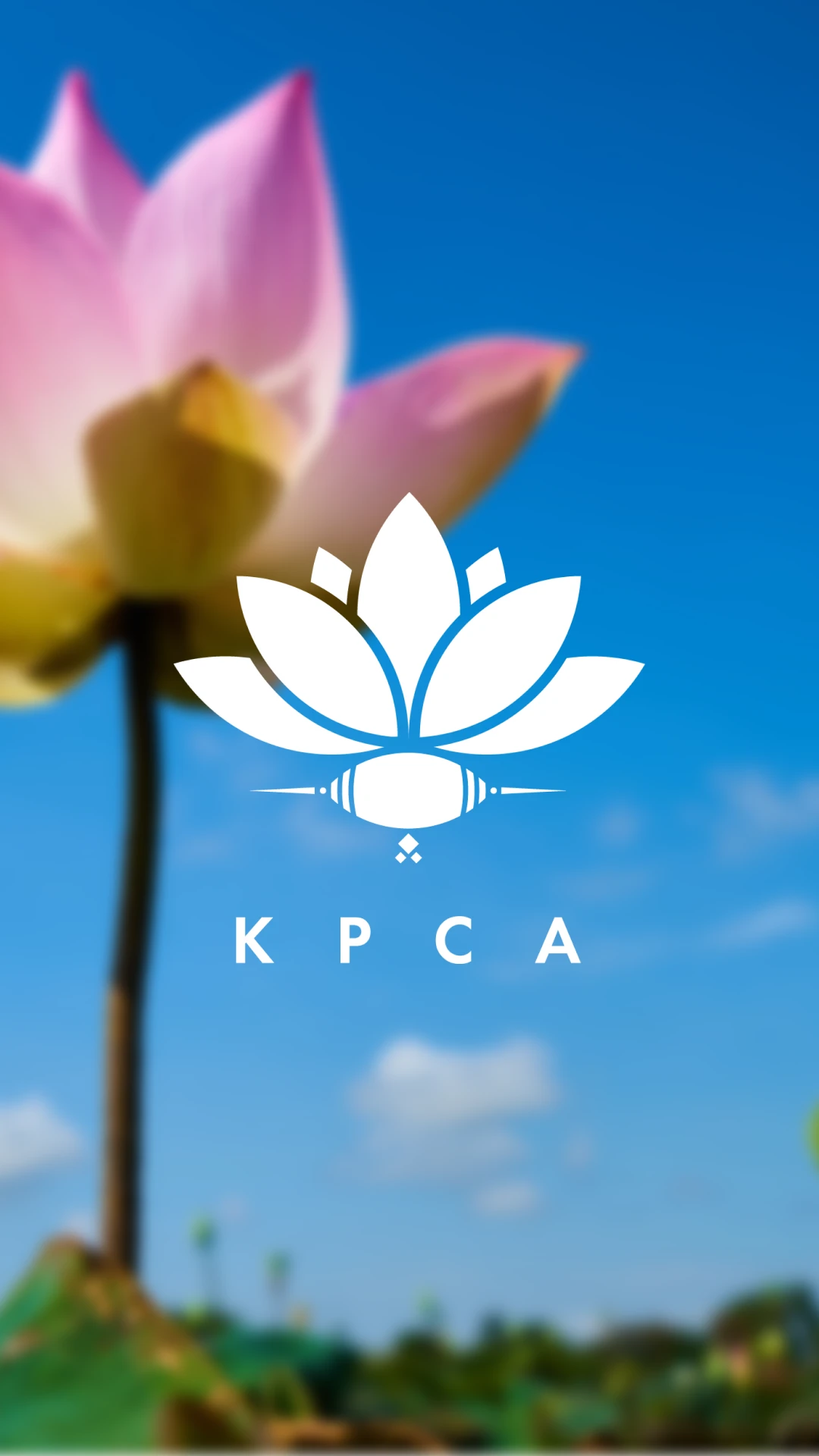 KPCA lotus mark and wordmark in white over a pink lotus against a blue sky
