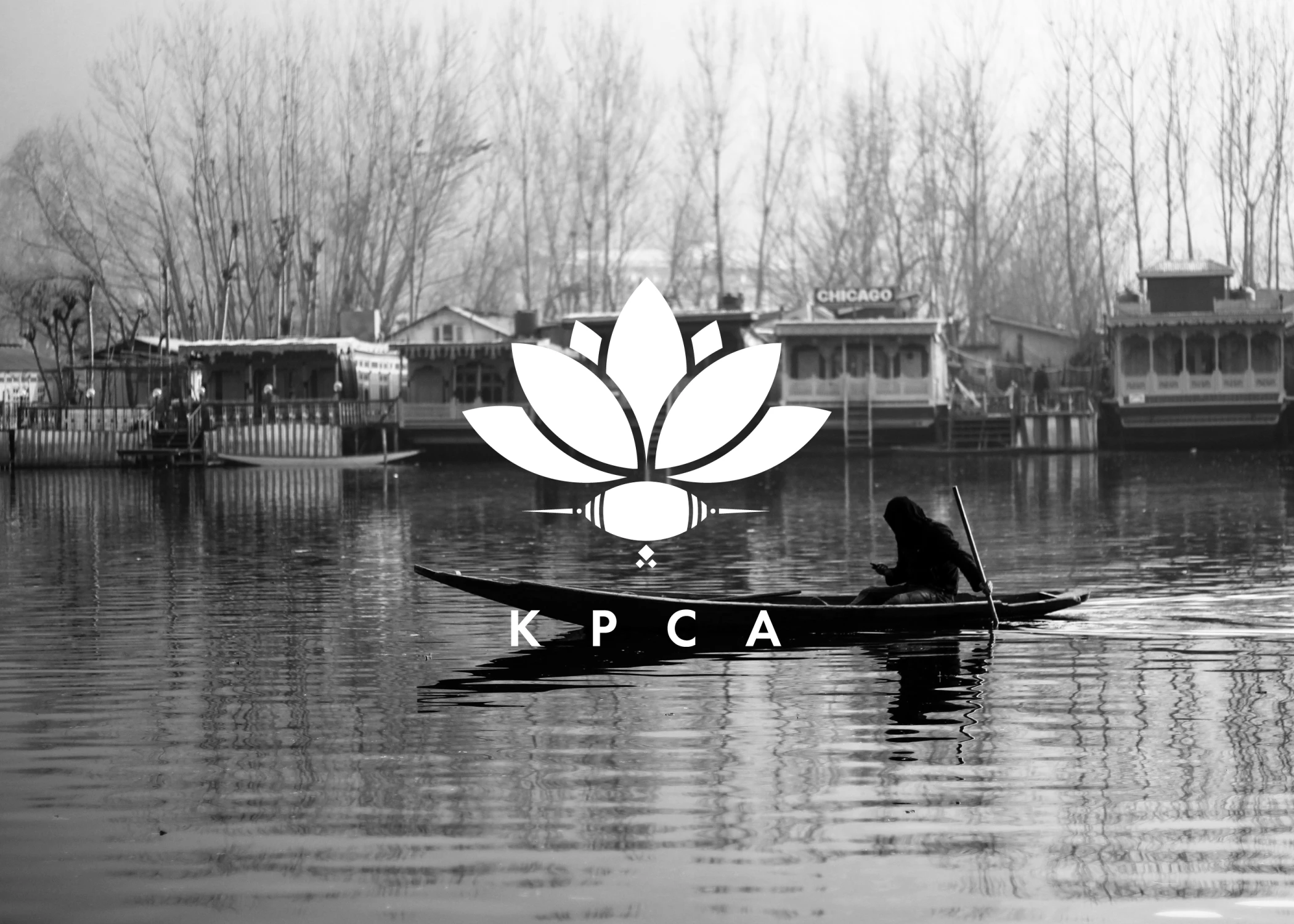 KPCA mark over a black-and-white photo of a shikara on Dal Lake